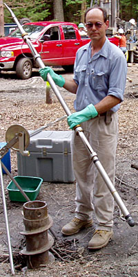 Preparing to lower an optical televiewer probe into a bedrock borehole